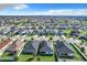 Aerial view of neighborhood with solar panels at 653 Persian Dr, Haines City, FL 33844
