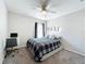 Cozy bedroom with a desk and window providing natural light at 653 Persian Dr, Haines City, FL 33844