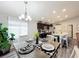 Charming dining room with a farmhouse table and chandelier at 653 Persian Dr, Haines City, FL 33844