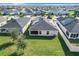 Aerial view of house with solar panels at 653 Persian Dr, Haines City, FL 33844
