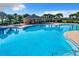 Relaxing community pool with shaded seating areas at 653 Persian Dr, Haines City, FL 33844