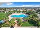 Community pool with palm trees and lounge chairs at 653 Persian Dr, Haines City, FL 33844