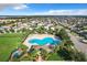 Community pool and surrounding landscaping at 653 Persian Dr, Haines City, FL 33844
