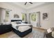Spacious bedroom with a queen-size bed and natural light at 830 Oakdale St, Windermere, FL 34786