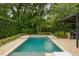 Relaxing pool with spacious patio and lush landscaping at 830 Oakdale St, Windermere, FL 34786