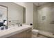 Modern bathroom with a large walk-in shower and marble vanity at 830 Oakdale St, Windermere, FL 34786