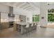 Modern kitchen with an island, stainless steel appliances, and white cabinetry at 830 Oakdale St, Windermere, FL 34786