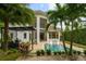 Stunning pool and patio area with outdoor kitchen and pergola at 830 Oakdale St, Windermere, FL 34786