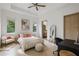 Well-lit bedroom with a workspace and comfortable seating at 830 Oakdale St, Windermere, FL 34786