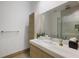 Clean bathroom, with a large mirror and modern vanity at 830 Oakdale St, Windermere, FL 34786