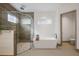 Modern bathroom featuring a soaking tub and walk-in shower at 830 Oakdale St, Windermere, FL 34786