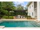Modern outdoor kitchen with built-in grill and pergola at 830 Oakdale St, Windermere, FL 34786