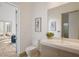Clean bathroom with a single sink vanity and access to patio at 830 Oakdale St, Windermere, FL 34786