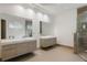 Spa-like bathroom with double vanity and large shower at 830 Oakdale St, Windermere, FL 34786