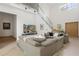 Spacious living room featuring a large sectional sofa and high ceilings at 830 Oakdale St, Windermere, FL 34786