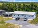 Aerial view of an office building with adjacent parking at 26721 Racquet Cir, Leesburg, FL 34748