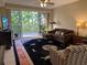 Living room with comfy seating and large windows at 6312 Buford St # 304, Orlando, FL 32835