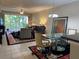 Living room with seating area and dining table at 6312 Buford St # 304, Orlando, FL 32835