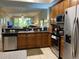 Kitchen with stainless steel appliances and wood cabinets at 6312 Buford St # 304, Orlando, FL 32835