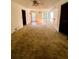 Bright living room with ample natural light and neutral carpeting at 50 Sheoah Blvd # 34, Winter Springs, FL 32708