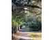 Shaded walkway with lush landscaping at 50 Sheoah Blvd # 34, Winter Springs, FL 32708