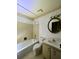 Clean bathroom with a bathtub, toilet, and vanity with a large mirror at 50 Sheoah Blvd # 34, Winter Springs, FL 32708