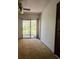 Bedroom with balcony access and neutral carpeting at 50 Sheoah Blvd # 34, Winter Springs, FL 32708