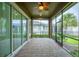 Spacious screened porch with brick pavers and ceiling fan at 7997 Greengard St, Orlando, FL 32827