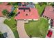 Aerial view of a single-Gathering home with solar panels and a pool at 8069 N Cadiz Ct, Orlando, FL 32836