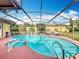 Inviting pool area with spa and screened enclosure at 8069 N Cadiz Ct, Orlando, FL 32836