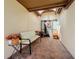 Inviting entryway with terracotta tile flooring, bench, and autumnal decor at 8069 N Cadiz Ct, Orlando, FL 32836