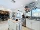 Eat-in kitchen with granite countertops, stainless steel appliances, and an island at 8069 N Cadiz Ct, Orlando, FL 32836