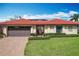 Single-Gathering home with red tile roof and landscaping at 8069 N Cadiz Ct, Orlando, FL 32836