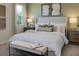 Serene bedroom with a king-size bed and calming decor at 3112 Windswept Way, Wildwood, FL 34785