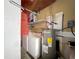 Laundry room with washer, dryer, and water heater at 2632 Muscatello St, Orlando, FL 32837