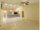 Open living area with tile floors and a breakfast bar at 8647 Otter Creek Ct, Orlando, FL 32829