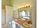 Double vanity bathroom with a large mirror and separate shower at 8647 Otter Creek Ct, Orlando, FL 32829