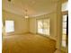 Spacious dining area with large windows and neutral decor at 8647 Otter Creek Ct, Orlando, FL 32829