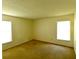 Simple carpeted bedroom with two windows and ample closet space at 8647 Otter Creek Ct, Orlando, FL 32829