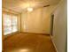 Bright dining room with large window, neutral walls, and carpet flooring at 8647 Otter Creek Ct, Orlando, FL 32829