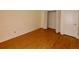Bedroom with laminate wood floors and a double door closet at 8647 Otter Creek Ct, Orlando, FL 32829