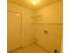 Laundry area with shelving and space for washer/dryer at 8647 Otter Creek Ct, Orlando, FL 32829