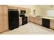 Bright kitchen features black appliances and light wood cabinets at 8647 Otter Creek Ct, Orlando, FL 32829