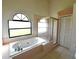 Bathroom boasts a large garden tub and separate shower at 8647 Otter Creek Ct, Orlando, FL 32829