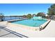 Community pool with lake views and a surrounding fence at 151 North Orlando Avenue # 142, Winter Park, FL 32789