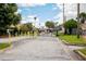 Gated community entrance with ample parking and clear signage at 962 Oropesa Ave, Orlando, FL 32807