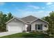 New home with gray and white exterior and landscaping at 2812 Gabion St, Bartow, FL 33830