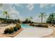 Community pool with lounge chairs and landscaping at 4511 Monado Dr, Kissimmee, FL 34746