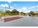 Community basketball court with red and gray surface at 4511 Monado Dr, Kissimmee, FL 34746
