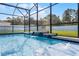 Relaxing pool with cascading water feature and tiled accents at 332 Citrine Loop, Kissimmee, FL 34758